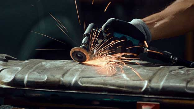 Sparks flying over metal object